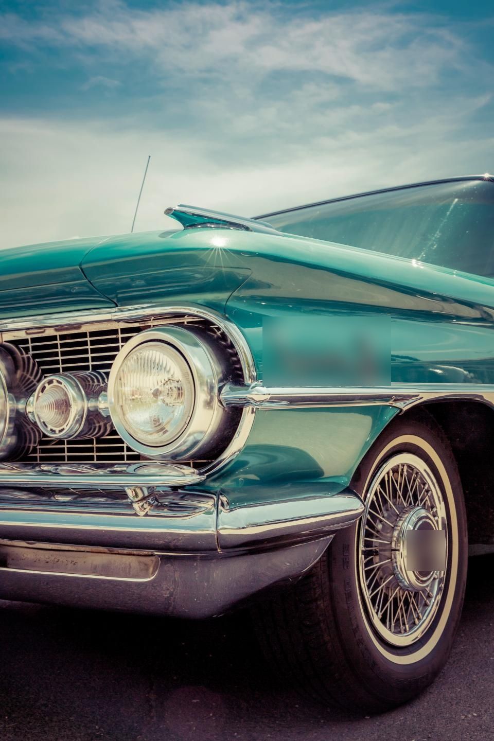 Front of a teal classic car